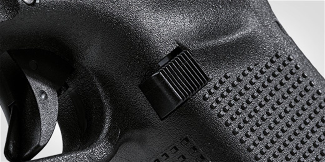 Reversible magazine catch